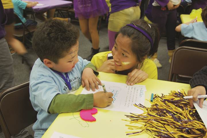 KINDER CARE - USB Commissioner Julia Kim interacts with a Quail Summit kindergarten student at the final event in the Golden Horseshoe.