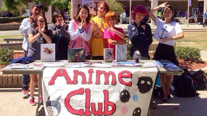 Anime+Club+members+pose+for+a+picture+during+Club+Rush+at+their+booth.