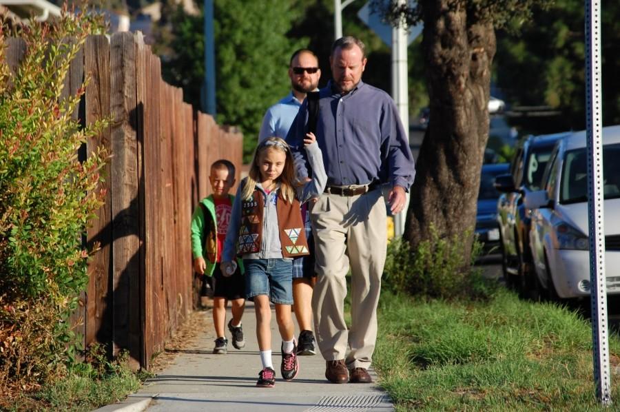 The trio of teachers meet up on a daily basis to walk their children to Evergreen.