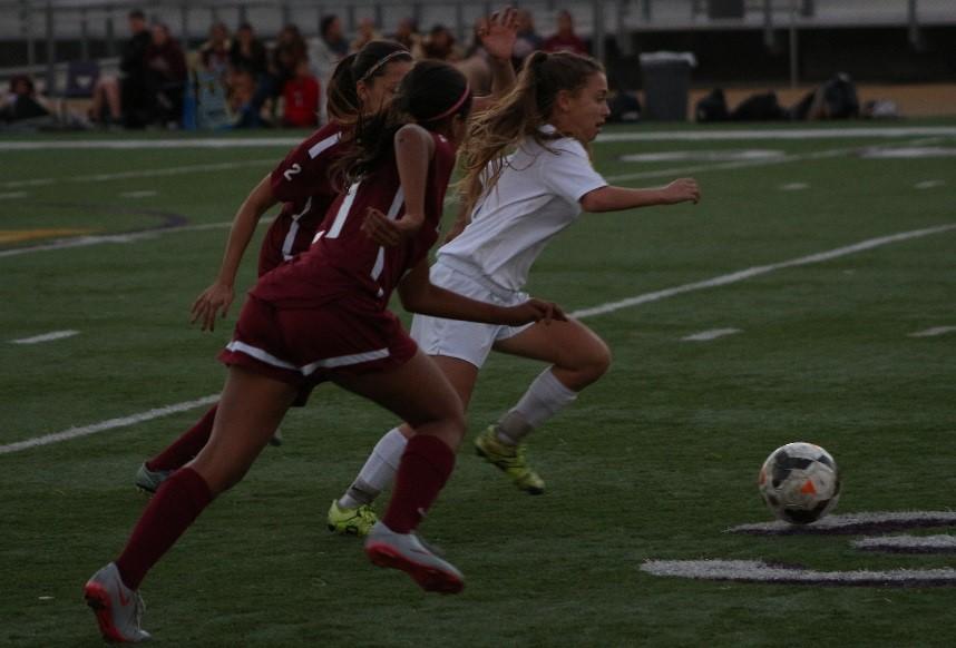 Sophomore Valerie Swisher chases down the ball in a match against the La Serna Lancers.