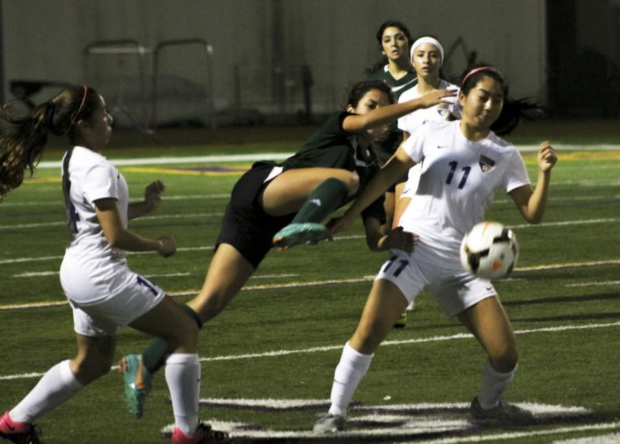 Junior Reena Kang defends the ball against the Bonita Bearcats as they try to steal the ball on Jan 19.