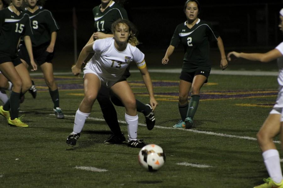 Senior Sabrina May defends the ball against an offensive striker in a match against the Bonita Bobcats.