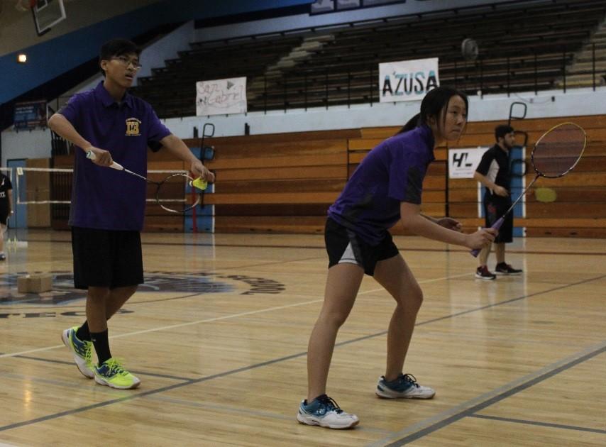 Junior Andrew Gao and sophomore Lucy Zhang play in a doubles match.
