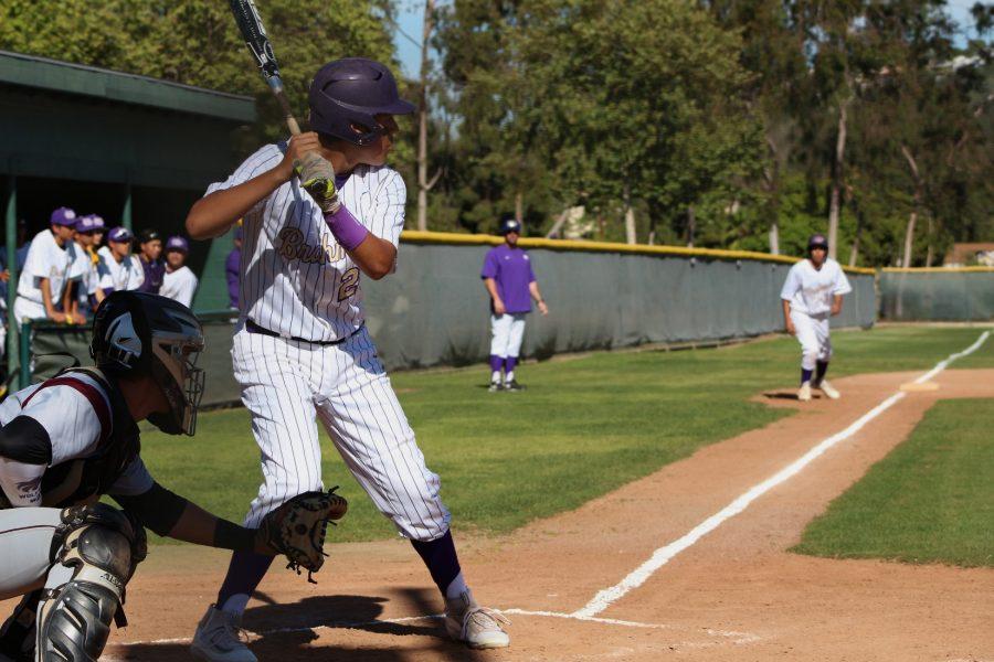 Sophomore Christian Killian prepares to bring a runner in from third base against the Claremont Wolfpack.
