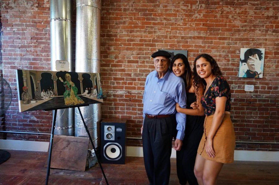 Simar Cheema, right, with her grandfather and sister, by her painting of Meena Kumari.  