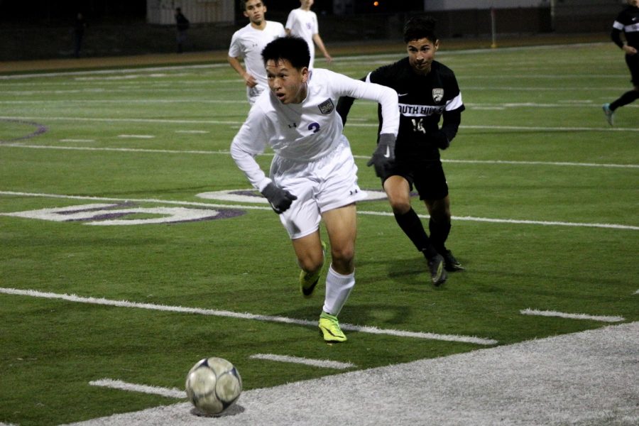 Junior Sebastian Jeon takes the ball down the pitch against South Hills.