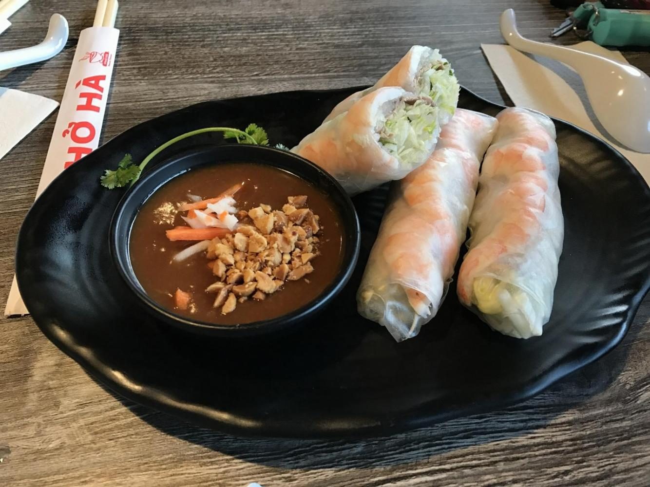 AMELIE LEE
Pho noodles and shrimp spring rolls with peanut sauce are served at the newly opened Pho Ha, located at the old Bob’s Big Boy location. The restaurant also offers various other types of Vietnamese food and drinks.