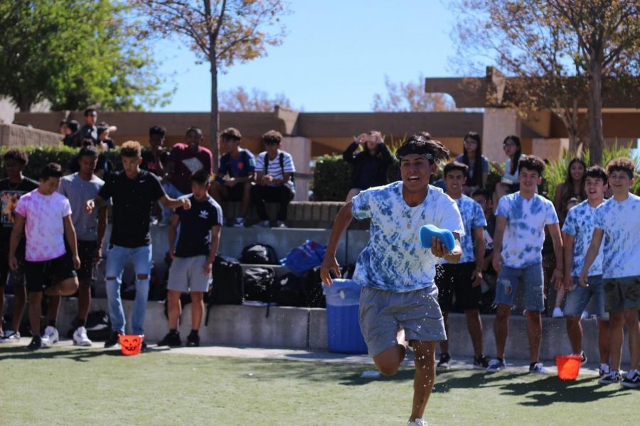 Senior Zack Marin competed for the blue team in the sponge relay as a part of  Rainbow Races in the ampitheater during lunch on Oct. 24.
