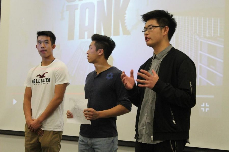 From left to right, seniors Ryan Trinh, Kilik Ov and Jacky Chen present their product, called Click, to a panel of judges.
