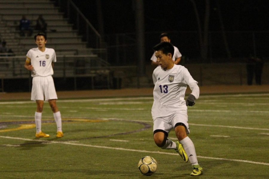 Senior midfielder Sebastian Jeon dribbles the ball up the field in a 2-1 win against South Hills.