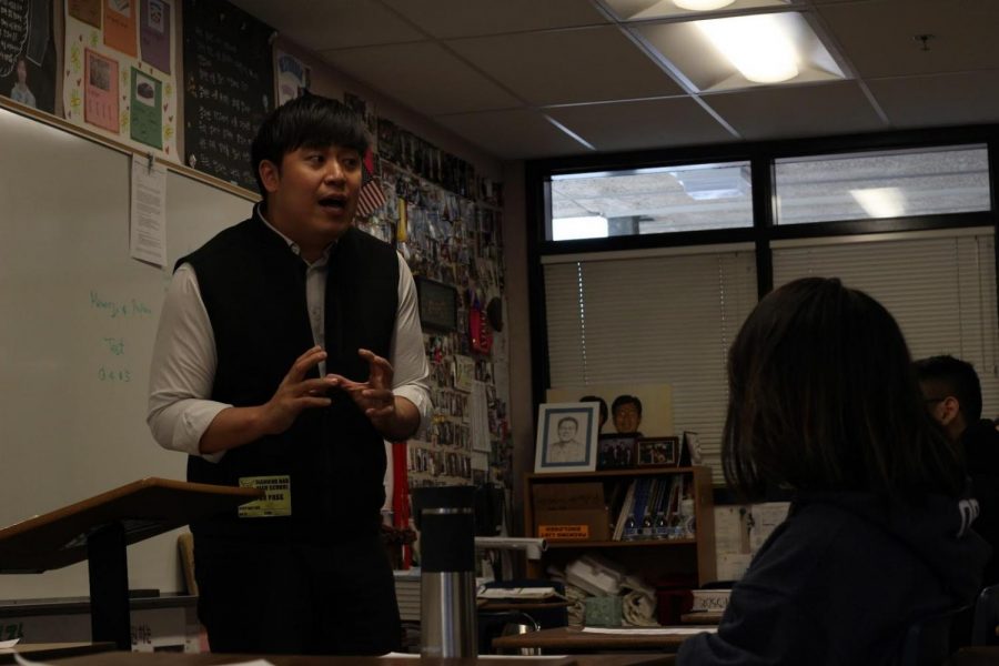Pastor Kim Taek Young speaks to Joy Club members at their weekly meeting.