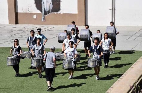World Line, the varsity drumline, rehearses for their final competition in the ampitheatre