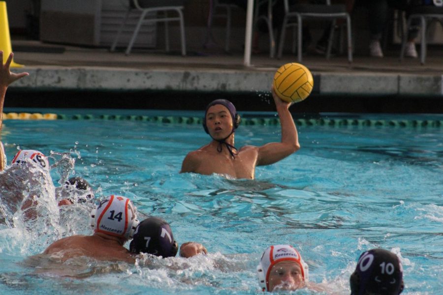 Senior Christian Cheung legs up against a Roosevelt defender in the 13-9 win.