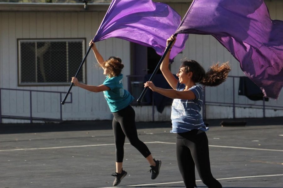 Color+guard+members+practicing+with+flags+during+after-school+rehearsal