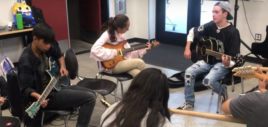 DBHS students visit Chaparral Middle School to help students in music.