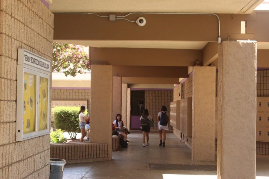 Security cameras can be seen in the hallways and on exterior walls on campus.
