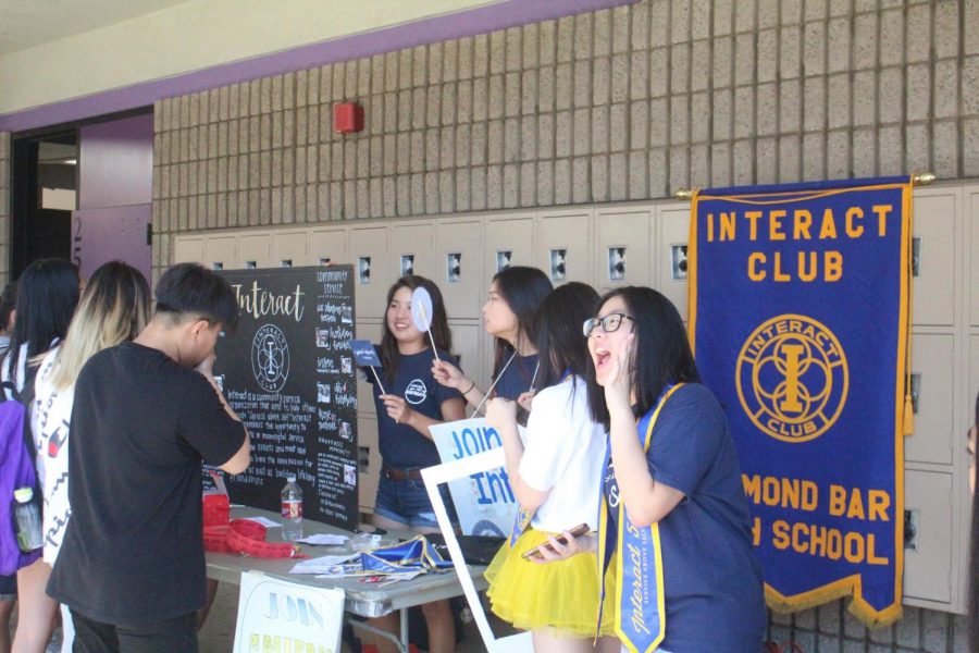 DBHS Sprocket Team 3473 members, from left, Caleb Yoon, Presley Moon and Kevin Tan showcase the robot demonstrating the 2019 FIRST Robotics Competition challenge “Destination: Deep Space” at Back To School Night on Aug. 30.