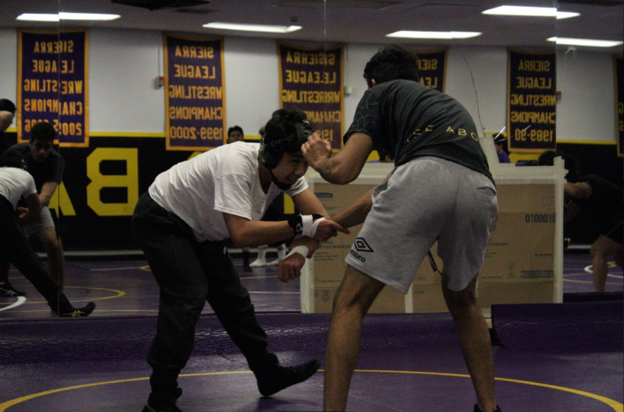 Wong practices sparring against a teammate to prepare for a league match.